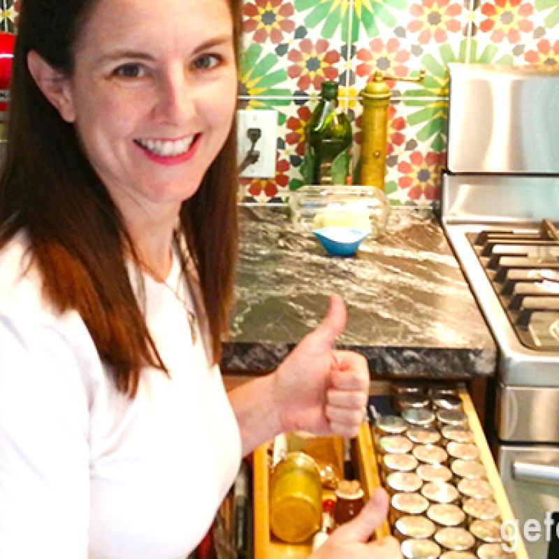 woman smiling in kitchen