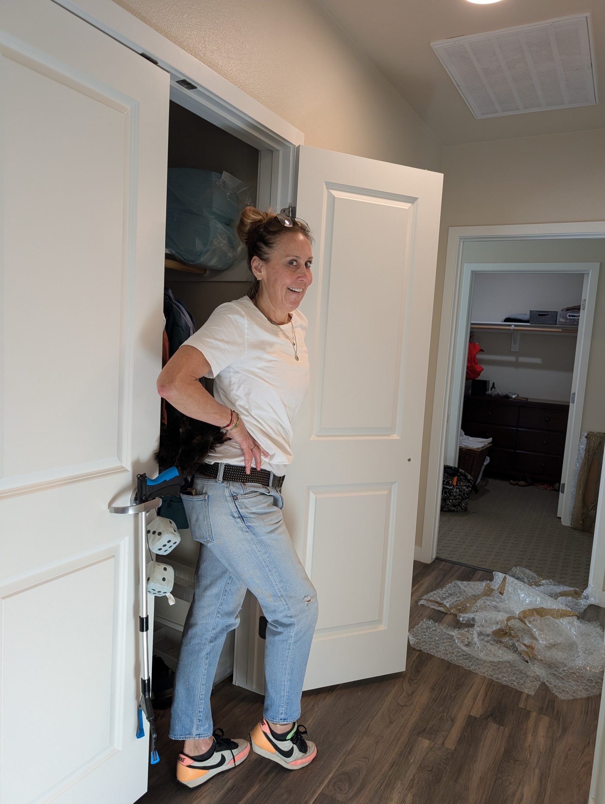 lady in front of closet doors