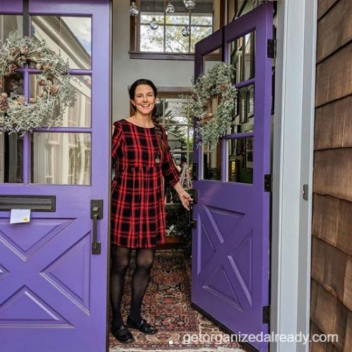 woman holding door open